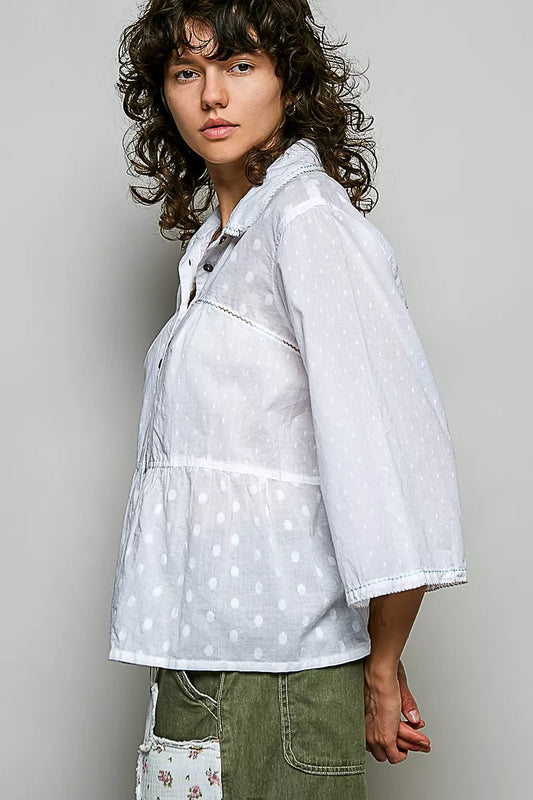 Tonal dot weave textured button-front shirt from Trendsi, featuring a classic collar and long sleeves, displayed on a mannequin.