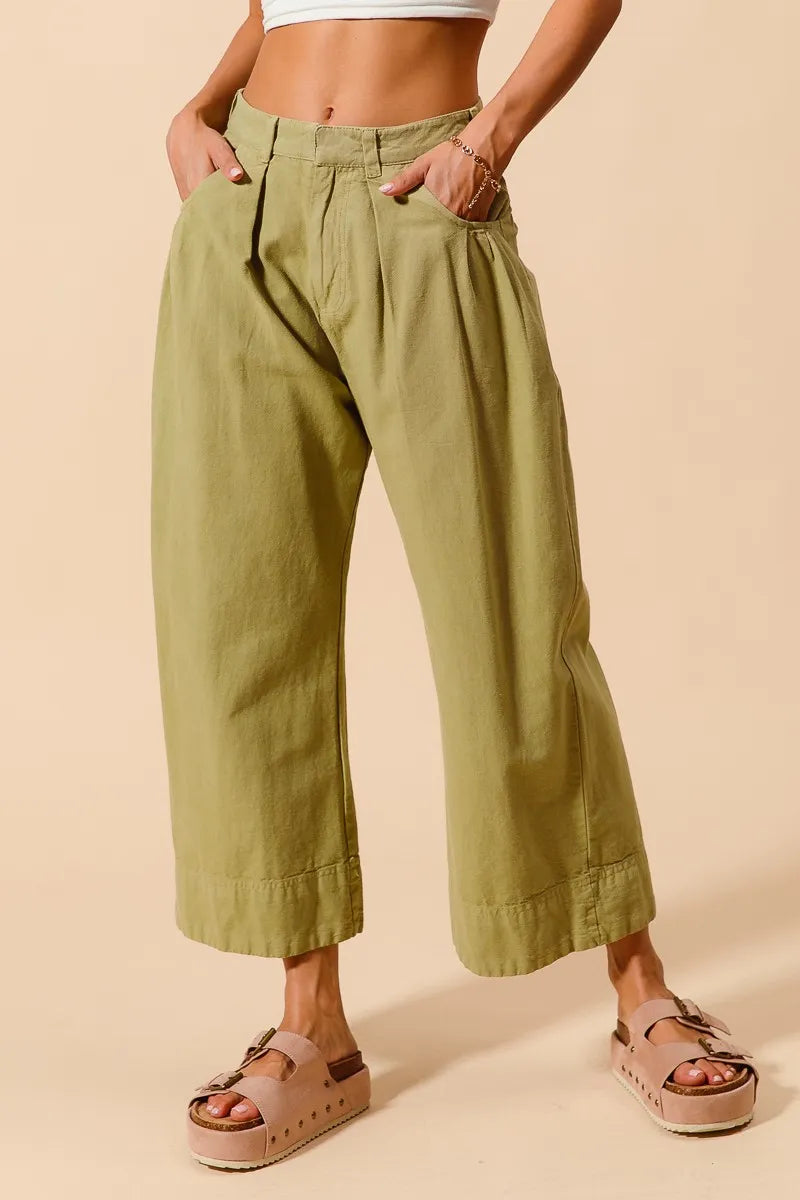 Trendsi SO ME mid-rise wide-leg chino pants with pockets, shown in a neutral fabric and relaxed fit style.