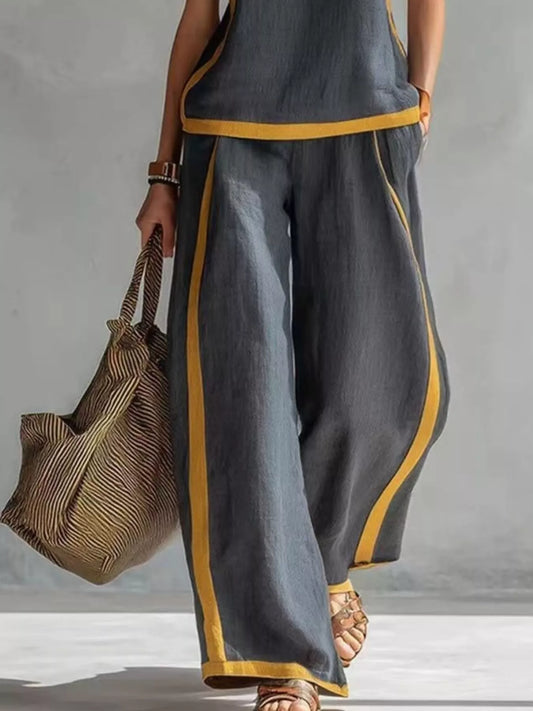 Trendsi sleeveless tank top and wide-leg pants set, featuring a casual, stylish outfit with a fitted tank and flowy pants.