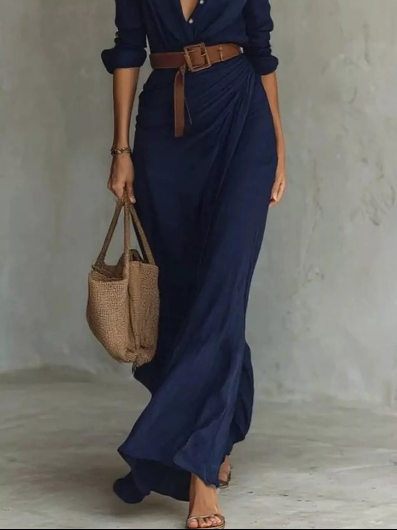 Plus size khaki ruched long sleeve maxi dress by Trendsi, full-length view showcasing fitted waist and flowing skirt.