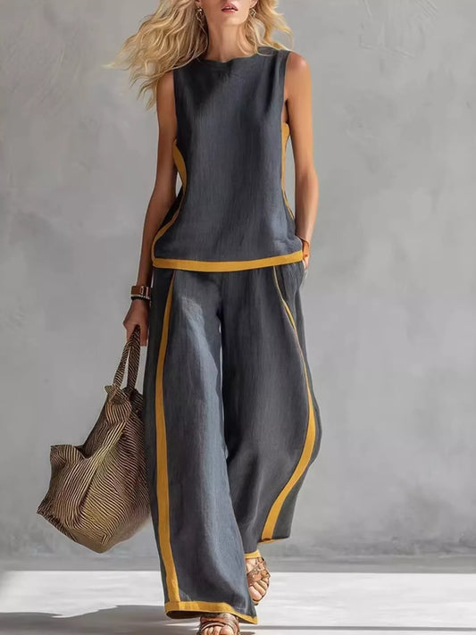 Sleeveless tank top and wide-leg pants set by Trendsi, featuring a stylish and comfortable matching casual outfit.