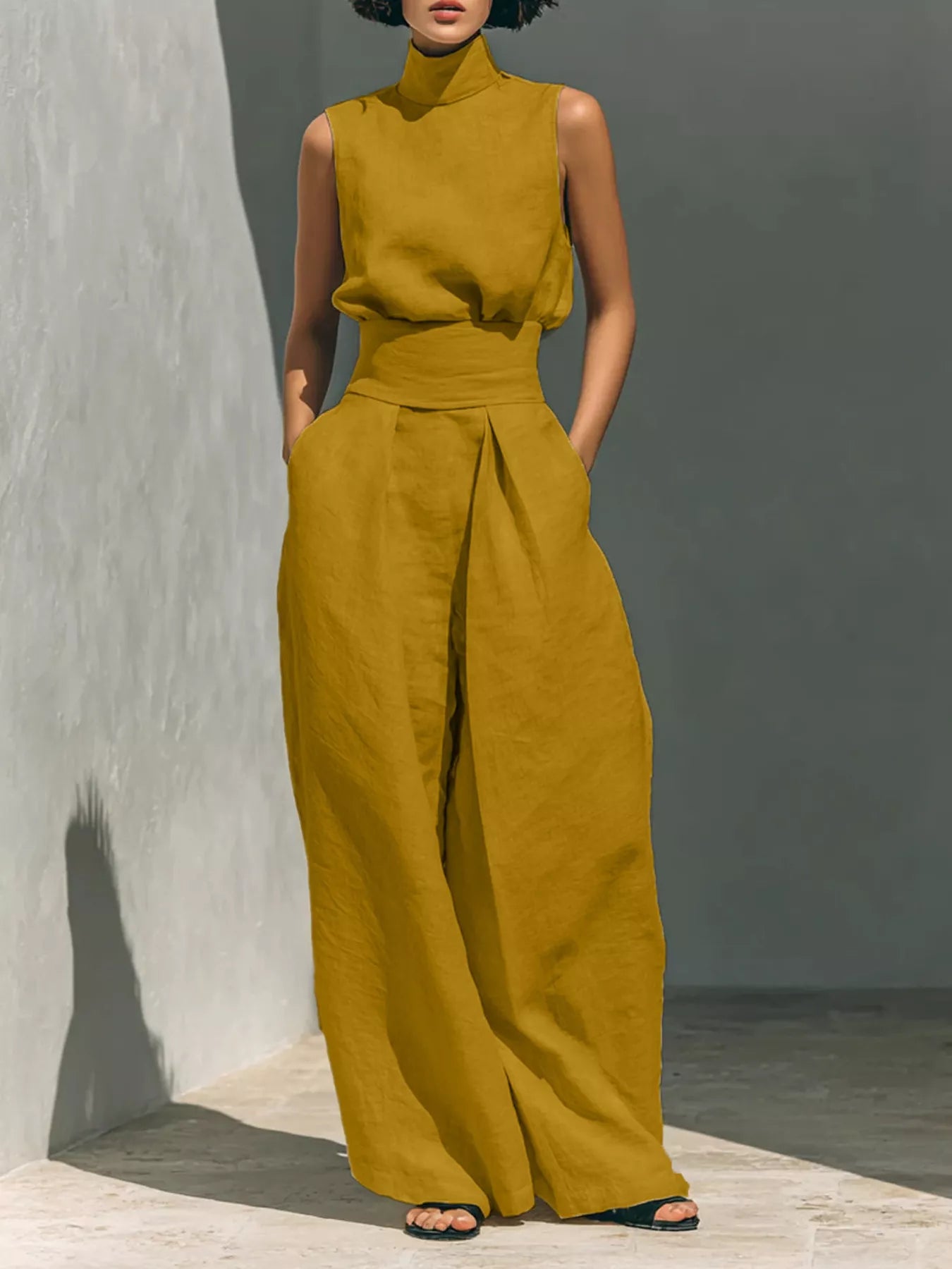 Plus size sleeveless wide-leg jumpsuit with smocked waist, full length, made by Trendsi, shown in a stylish, comfortable fit.