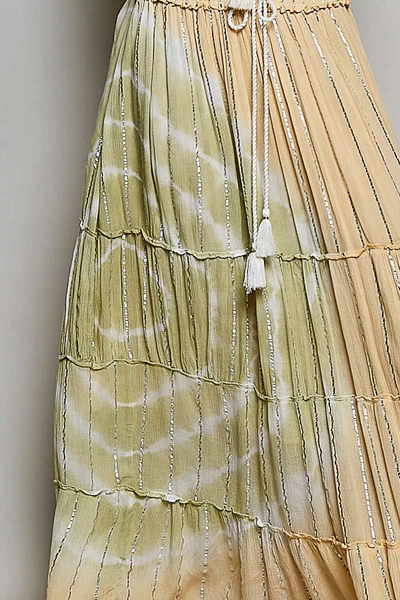 Trendsi POL shimmer tiered maxi skirt with reverse ruffle design and smocked waist, flowing and elegant for casual or dressy wear.