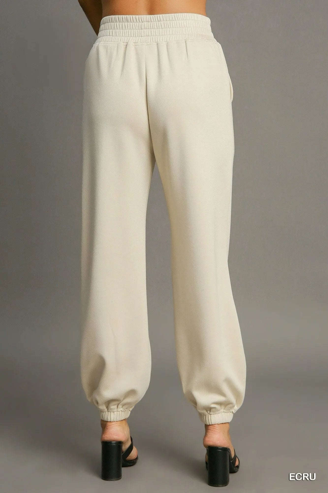 Umgee drawstring jogger pants with front seam detail, featuring a relaxed fit and casual style, shown in black fabric.
