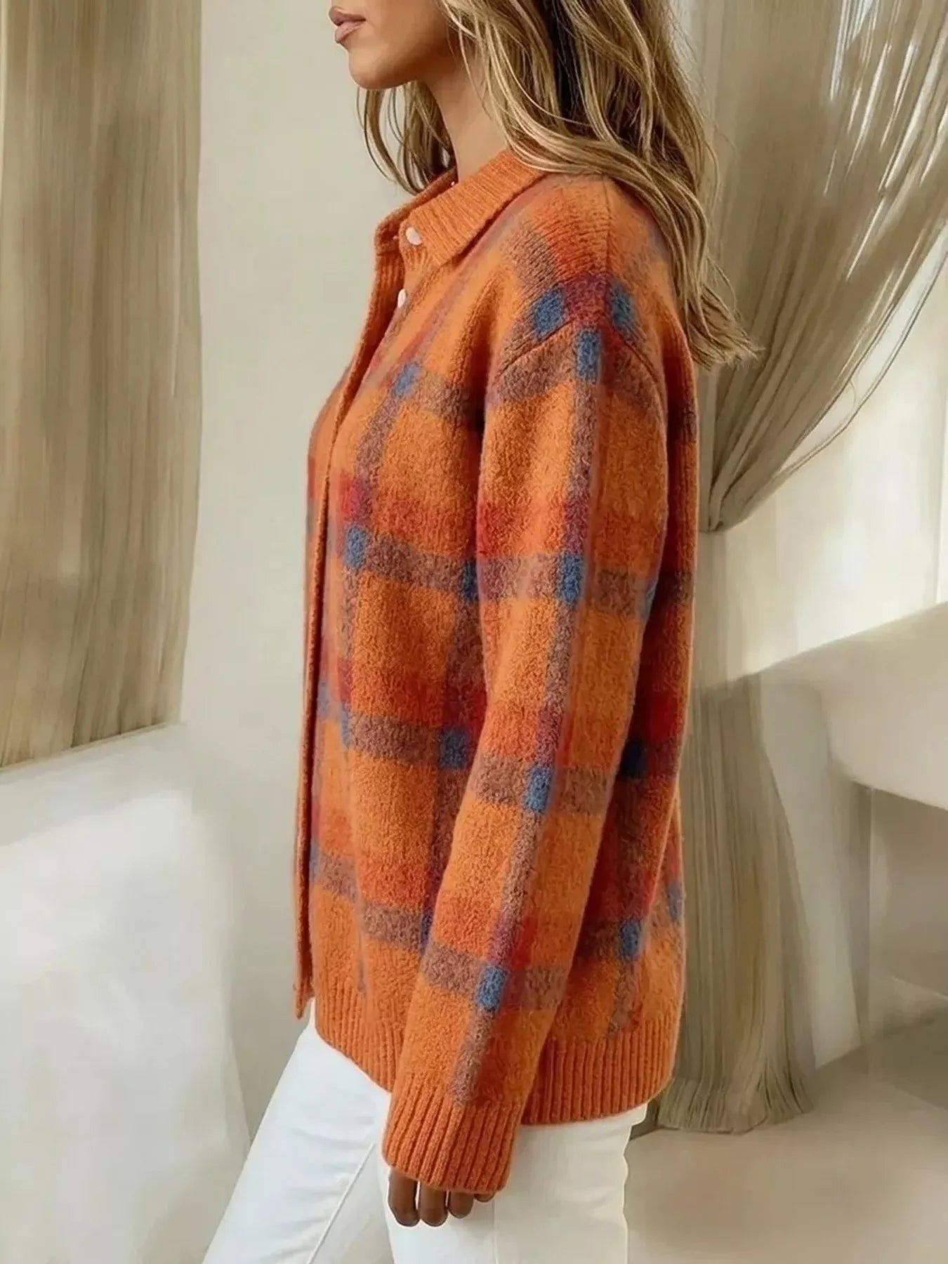 Plaid button-up cardigan by Trendsi featuring a classic pattern, button closure, and cozy knit fabric for casual style.