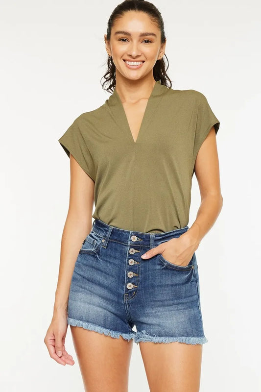 Kancan high rise frayed hem denim shorts in light wash, featuring distressed details and a casual fit, displayed on a white background.