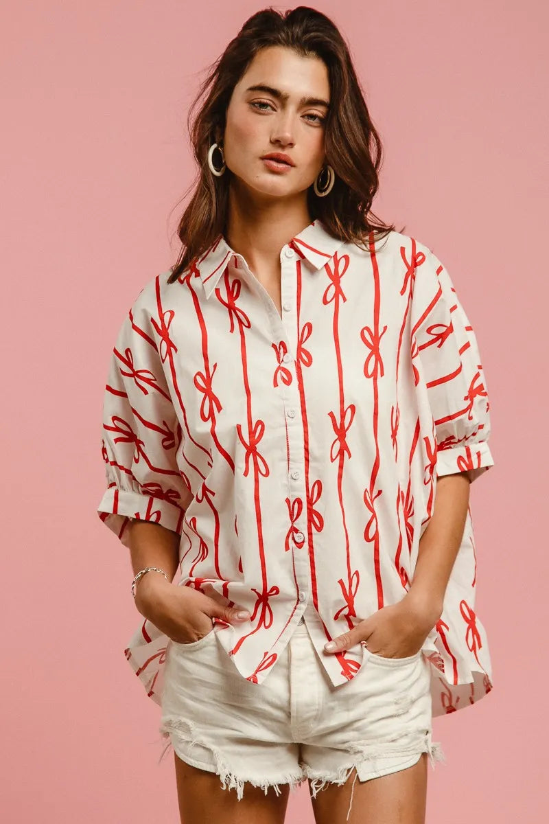 Woven printed button-down shirt with BiBi Bow Ribbon detail from Trendsi, featuring a stylish design and lightweight fabric.