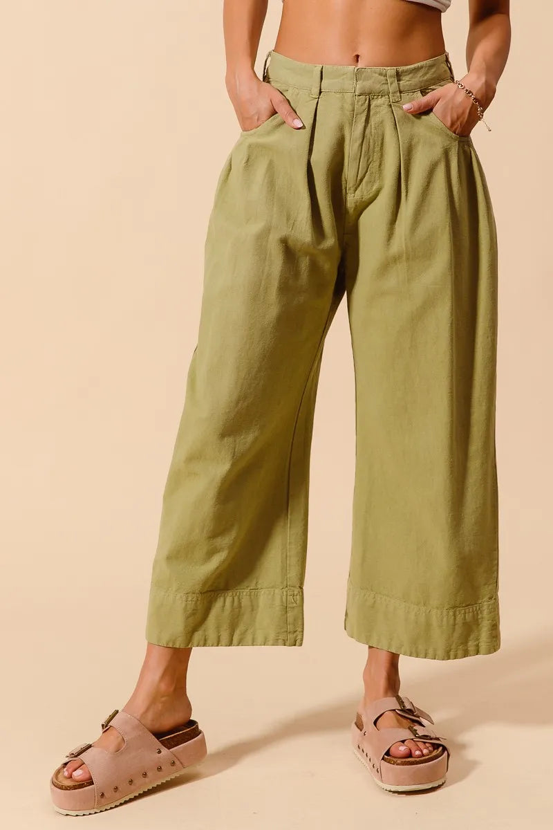 Trendsi SO ME mid-rise wide-leg chino pants with pockets, shown in a natural relaxed fit and neutral color.