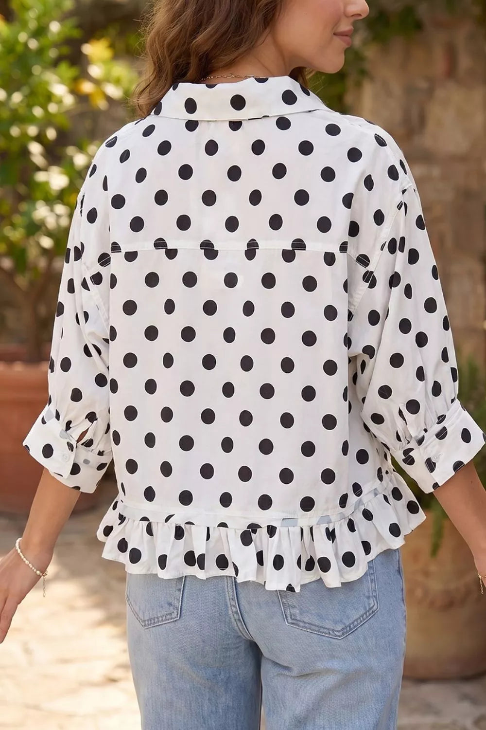 Polka dot print casual shirt with three-quarter sleeves and ruffle hem, made by Trendsi.