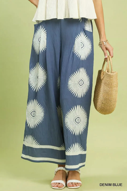 Umgee abstract border print wide-leg pants with flowy fabric and relaxed fit, featuring bold design and wide-leg silhouette.