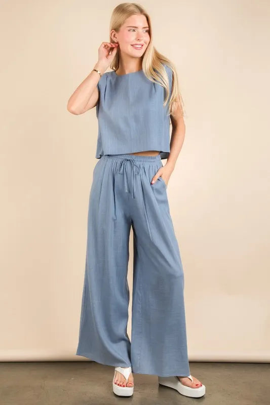 Woven top and pants set by VERY J Solid in a trendy, stylish design, featuring a coordinated look from Trendsi.