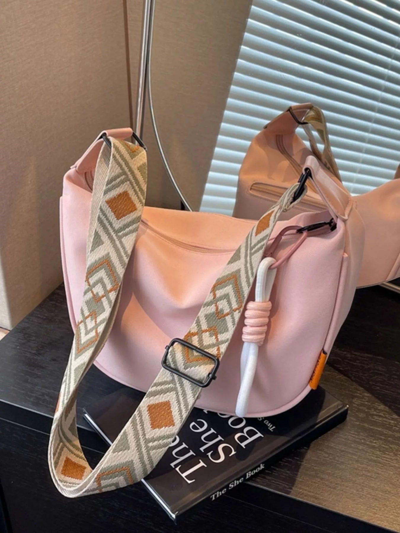 Geometric strap crossbody bag by Trendsi featuring a modern design with colorful geometric patterns and adjustable strap.