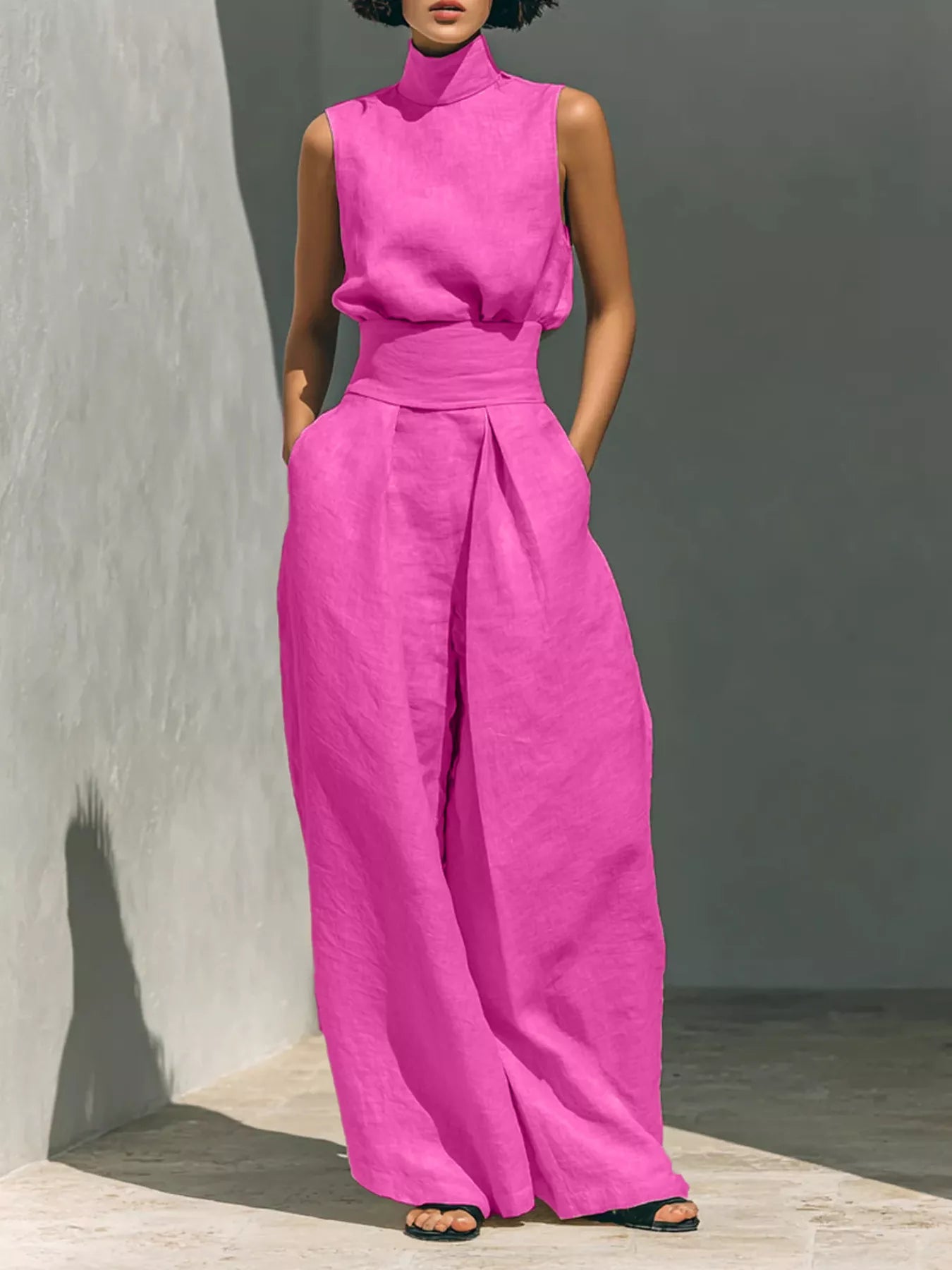 Plus size sleeveless wide-leg jumpsuit with smocked waist by Trendsi, shown in full size with flowing fabric and relaxed fit.