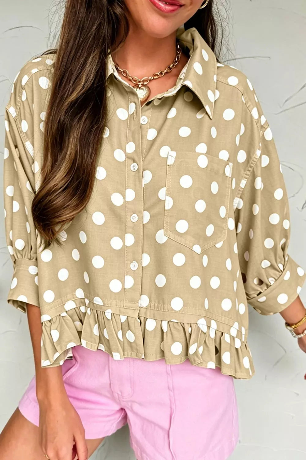 Polka dot print casual three-quarter sleeve ruffle hem shirt by Trendsi, featuring a relaxed fit and stylish design.