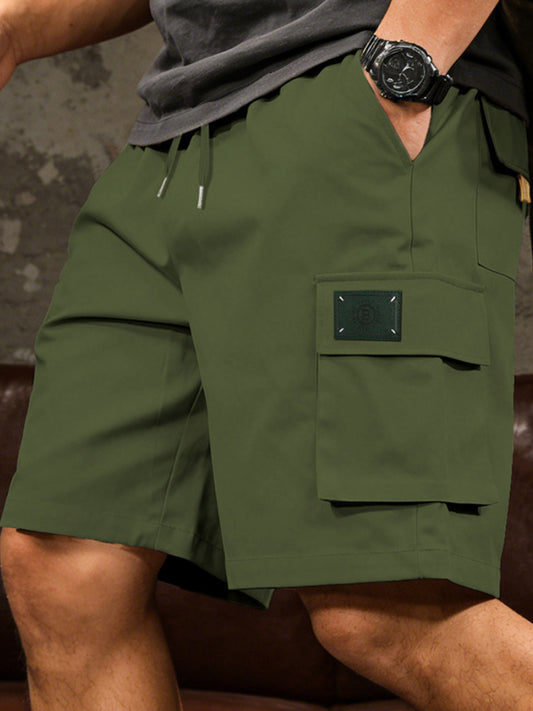 Men's full size cargo shorts with drawstring waist, plus size, casual outdoor wear, by Trendsi, featuring multiple pockets and comfortable fit.