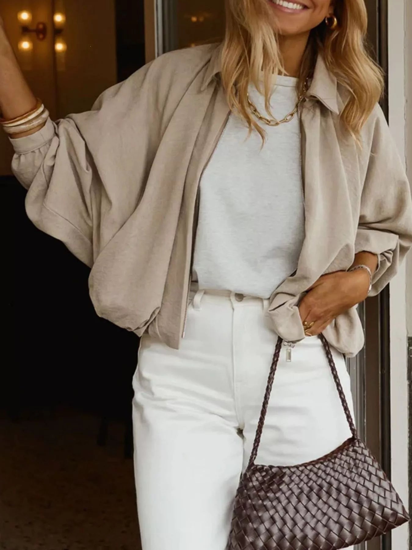 Trendsi zip-up long sleeve bomber jacket with ribbed cuffs and collar, shown in black on a model.