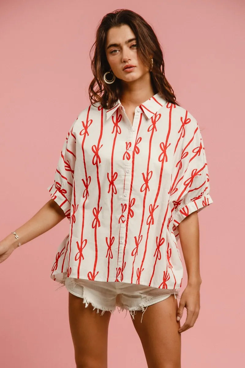 Woven printed button-down shirt with BiBi Bow Ribbon details, featuring a trendy, lightweight fabric perfect for casual or stylish looks.