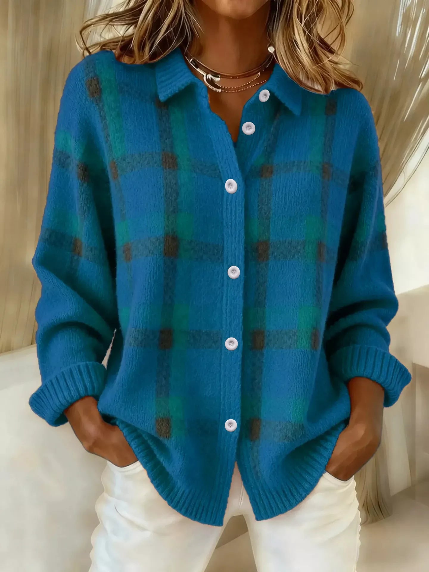 Plaid button-up cardigan by Trendsi featuring a classic pattern, long sleeves, and front buttons, perfect for casual layering.
