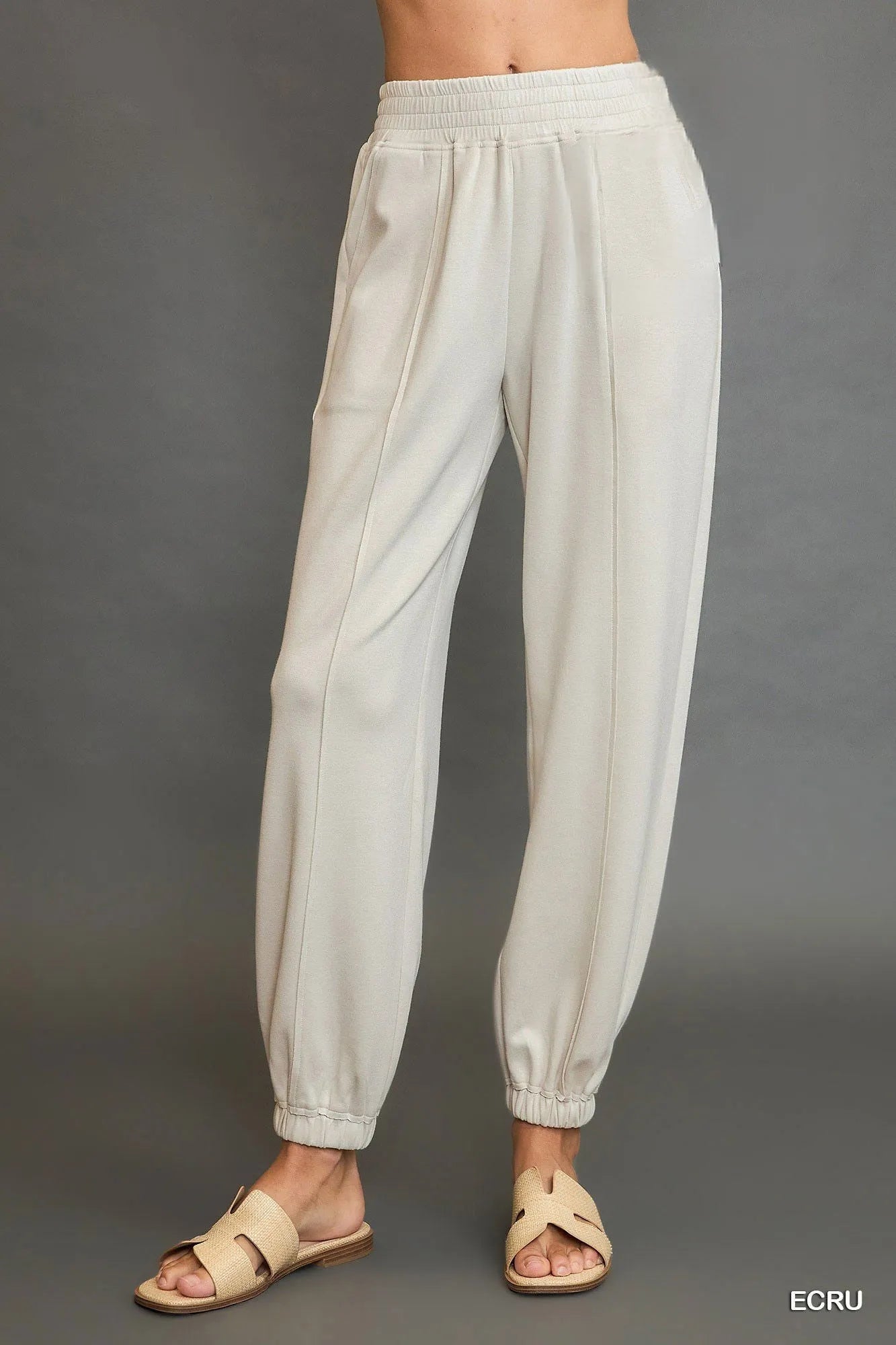 Umgee drawstring jogger pants with front seam detail, casual fit, and comfortable elastic waistband, stylish activewear for everyday wear.