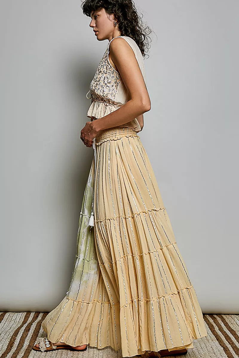 Trendsi POL shimmer tiered maxi skirt with reverse ruffle design and smocked waist, featuring a flowing, shimmering fabric.