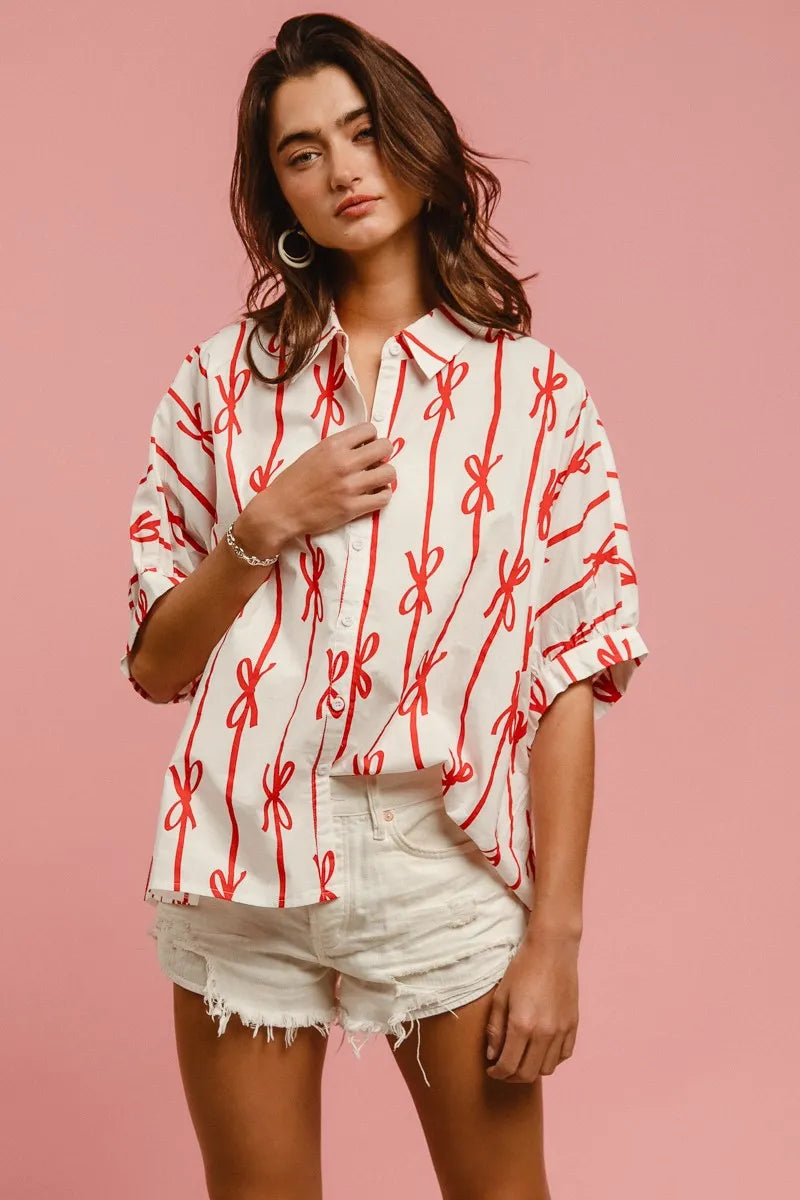 Woven printed button-down shirt with BiBi Bow Ribbon detail, stylish and lightweight, by Trendsi, shown in a close-up view.