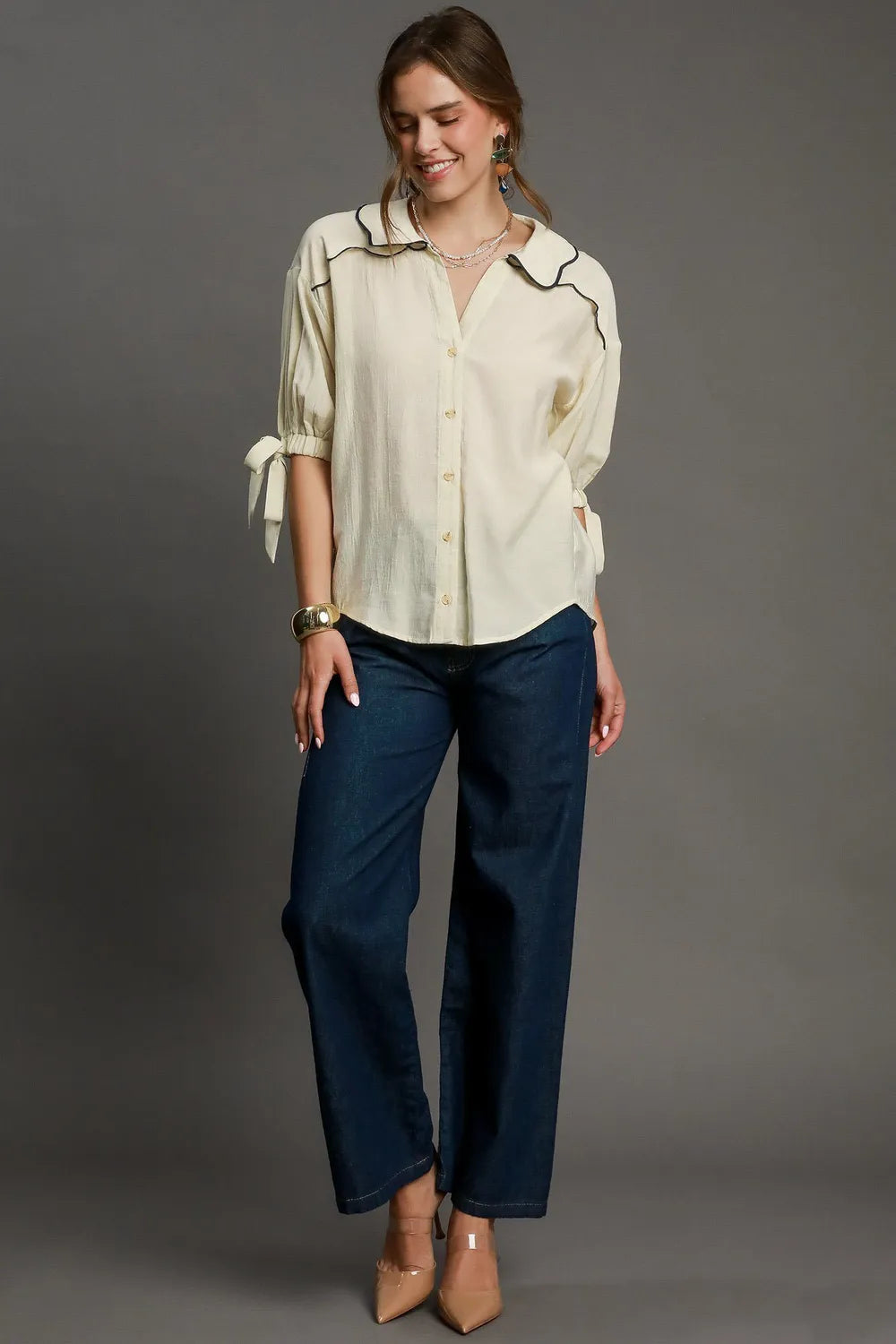 Plus size Umgee embroidered detail button-down shirt with long sleeves, showcasing intricate embroidery and classic collar design.