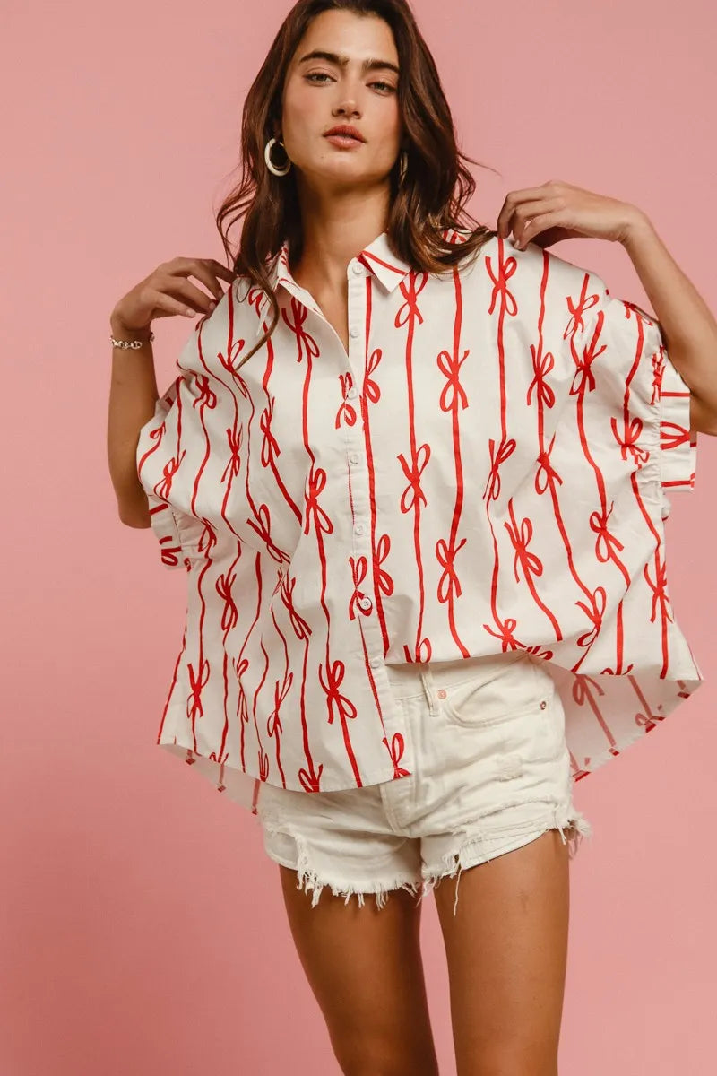 Printed button-down shirt from Trendsi featuring woven fabric, BiBi Bow Ribbon details, and a stylish collar design.