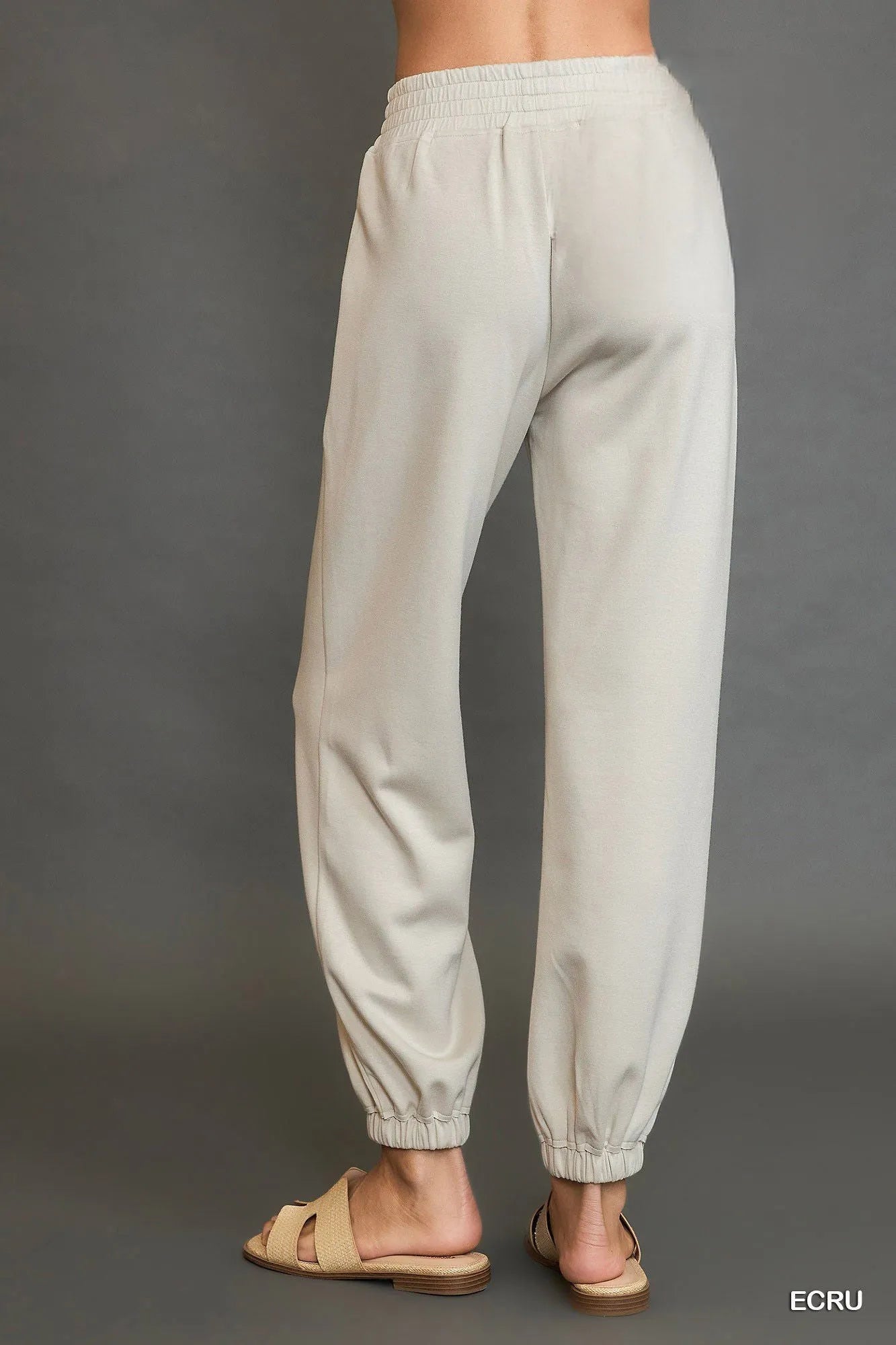 Umgee drawstring jogger pants with front seam detail, casual activewear featuring comfortable fit and stylish design.