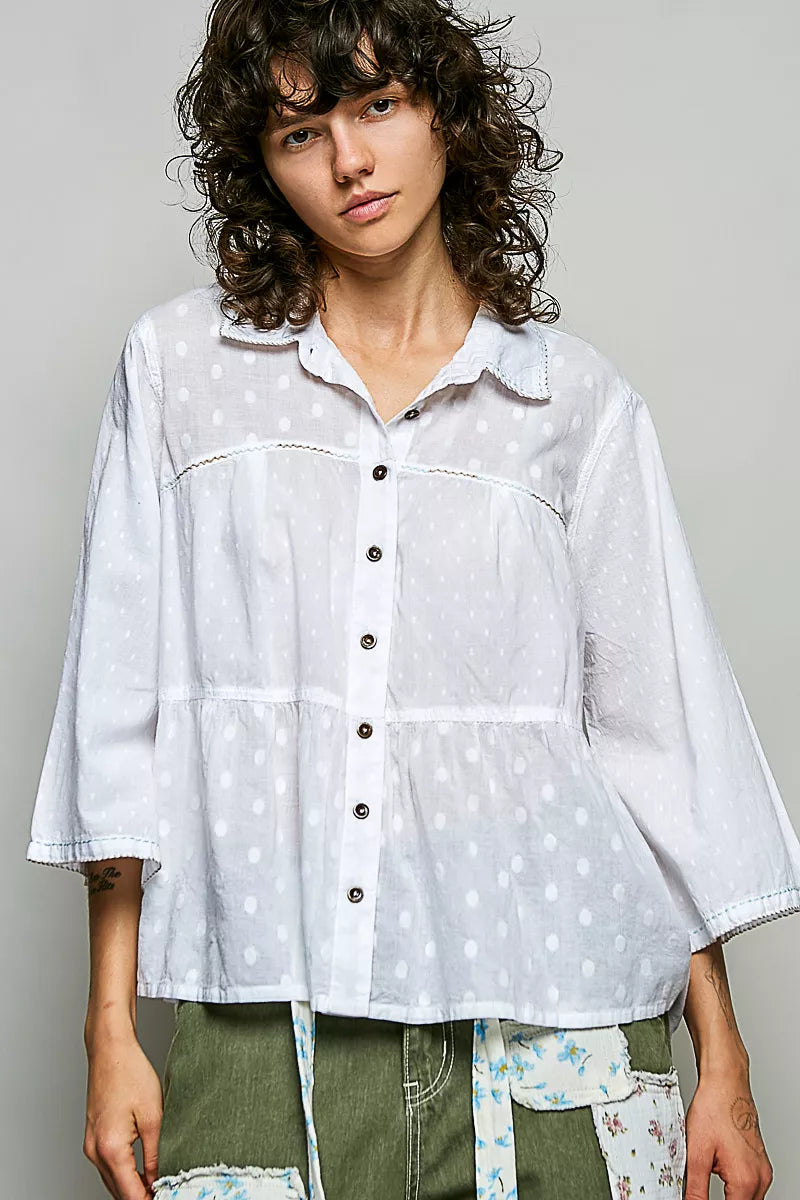 Tonal dot weave textured button front shirt by Trendsi, showcasing a close-up of the fabric and button details.