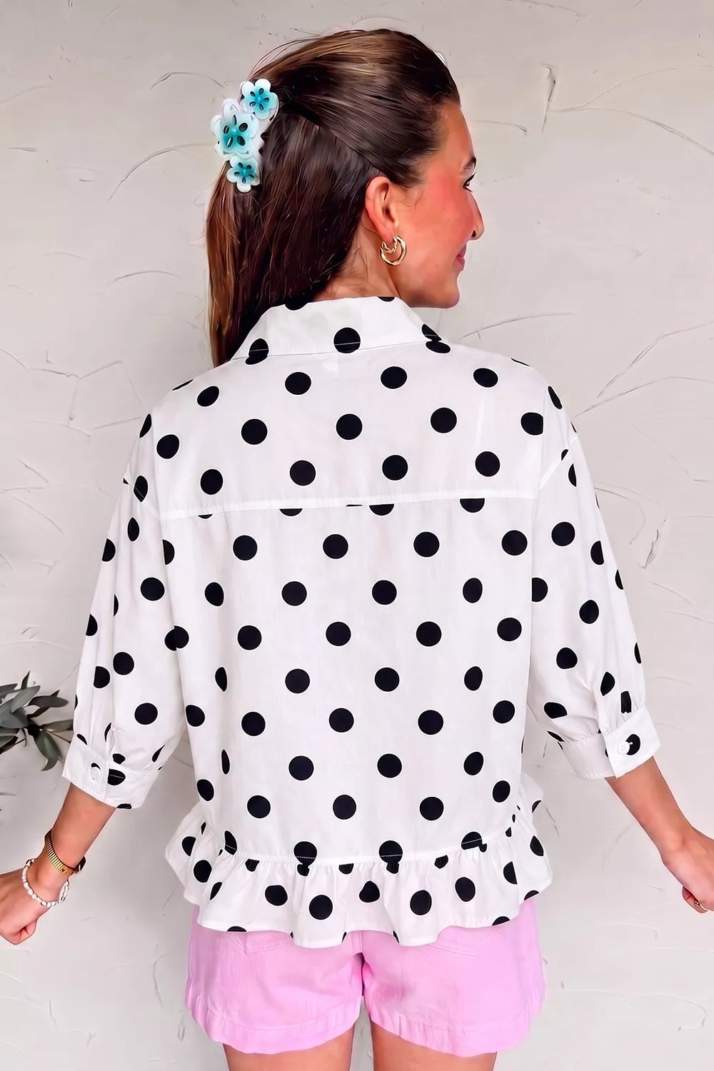 Polka dot print three-quarter sleeve casual shirt with ruffle hem from Trendsi, showing the soft fabric and stylish design.