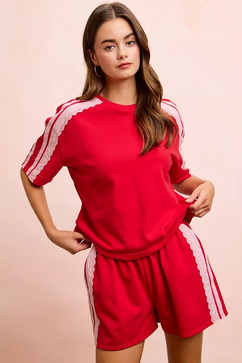BiBi French Terry short sleeve top by Trendsi with side lace detail, casual and stylish, cozy fabric, and relaxed fit.