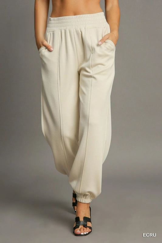 Umgee drawstring jogger pants with front seam detail, casual athletic style, in soft fabric, shown on a model.