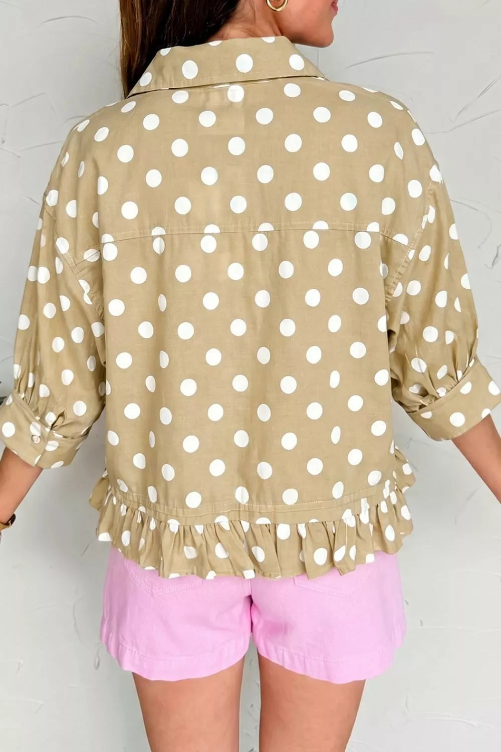 Polka dot print three-quarter sleeve casual shirt with ruffle hem, stylish and comfortable, by Trendsi.
