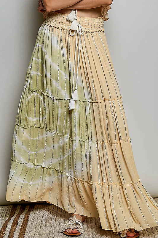 Trendsi POL shimmer tiered maxi skirt with reverse ruffle design and smocked waist, featuring a flowing, layered silhouette.