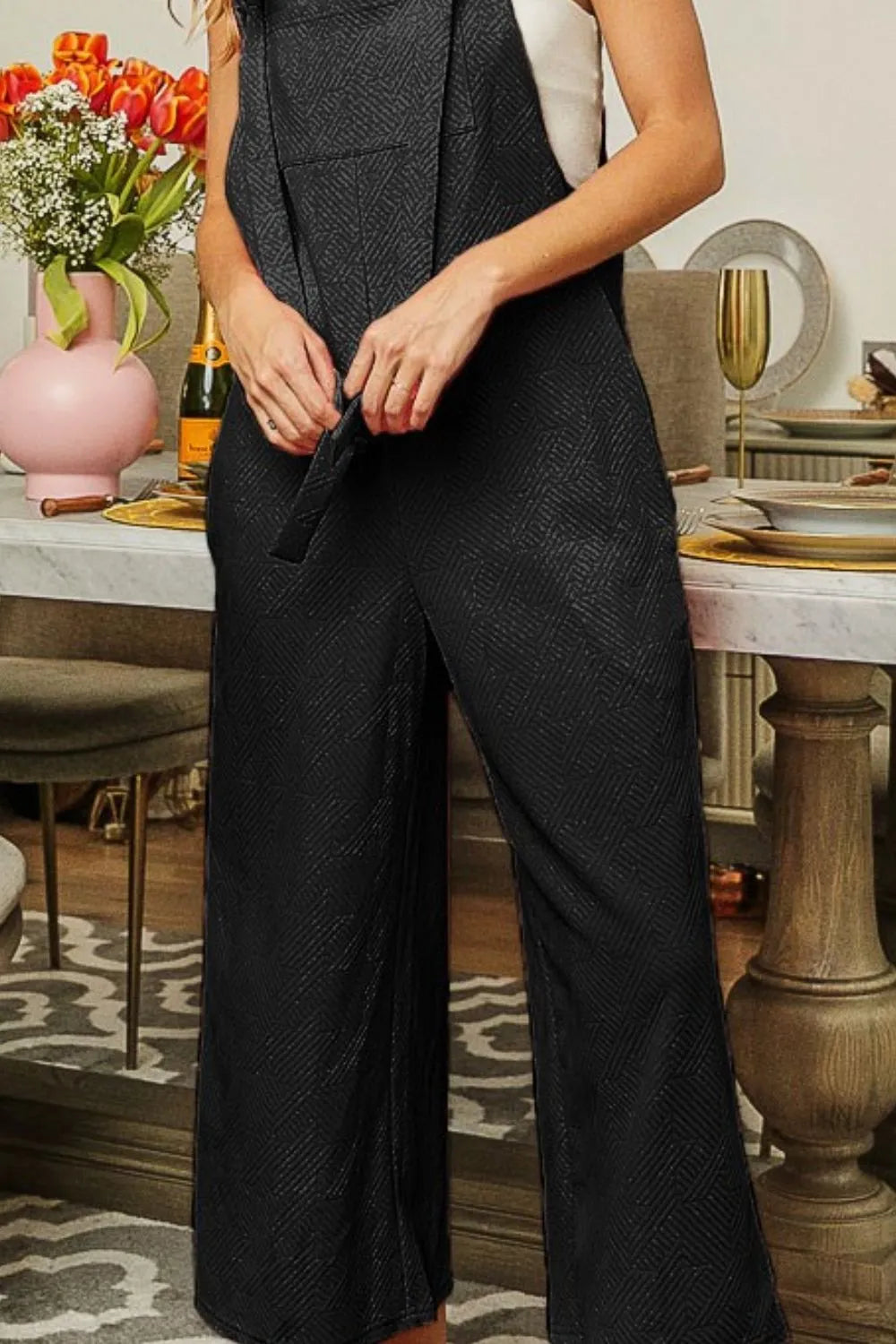 BiBi textured jacquard jumpsuit with side pockets, featuring a stylish fit and intricate fabric design, by Trendsi.