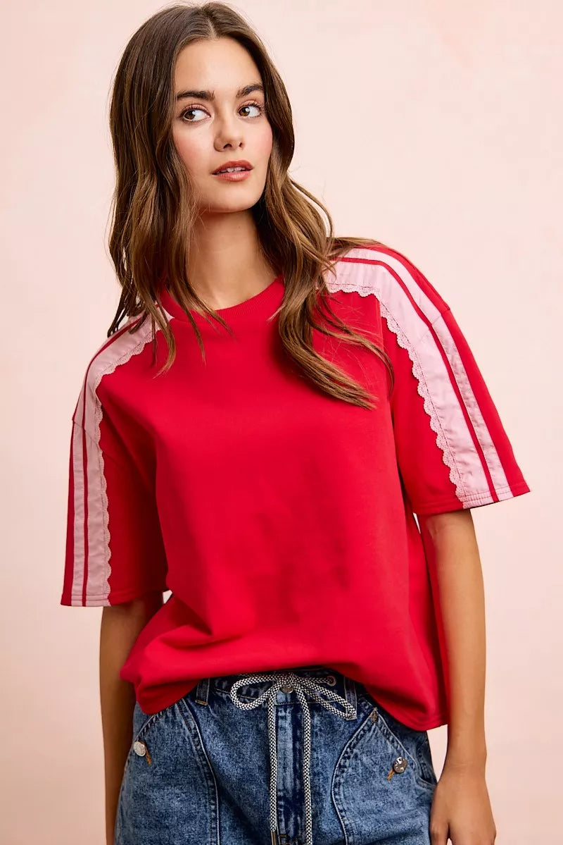 BiBi French Terry short sleeve top with side lace detail, casual trendy fashion by Trendsi, shown in a close-up image.