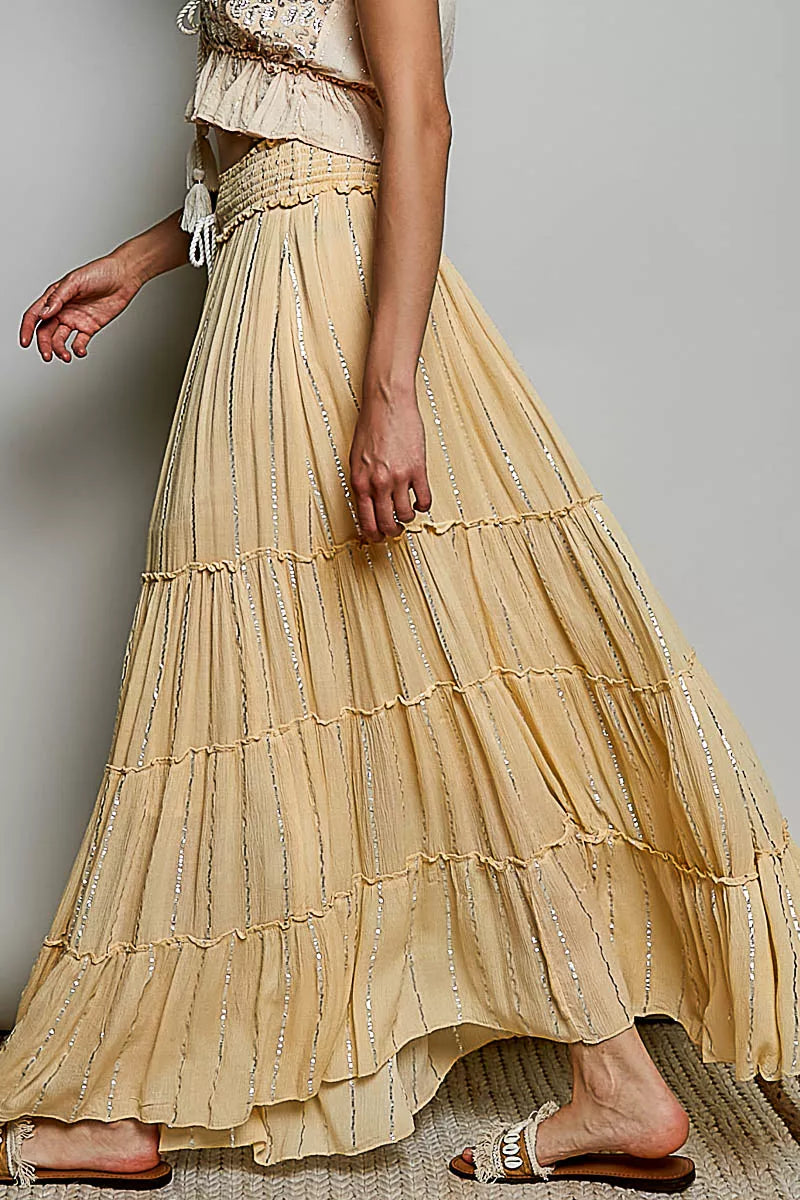 Trendsi POL shimmer tiered reverse ruffle maxi skirt with smocked waist, featuring a flowing, layered design and shimmering fabric.