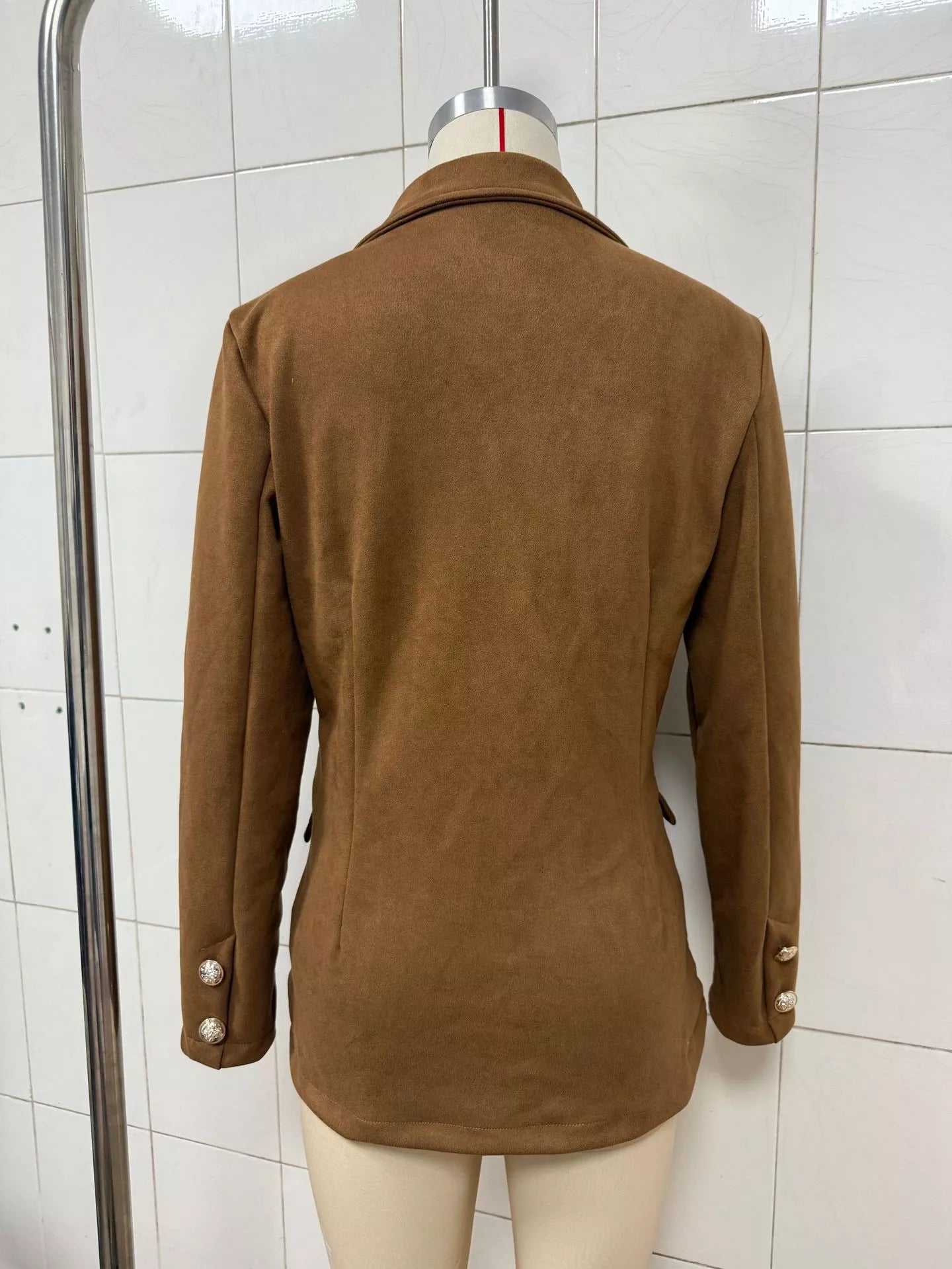 Black single-breasted blazer with lapel collar, tailored fit, and sleek design, perfect for professional or casual wear.
