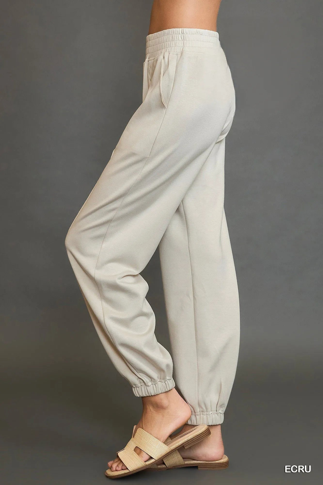 Umgee drawstring jogger pants with front seam detail, casual comfortable pants in soft fabric, styled for relaxed wear.