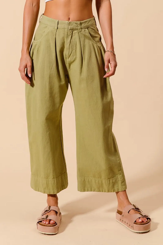 Trendsi SO ME mid-rise wide-leg chino pants with front and back pockets, in a neutral color, styled for casual wear.