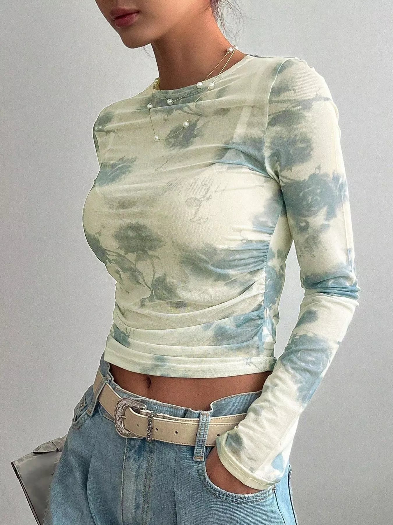 Floral print sheer mesh long sleeve T-shirt from Trendsi, lightweight and stylish with vibrant floral design
