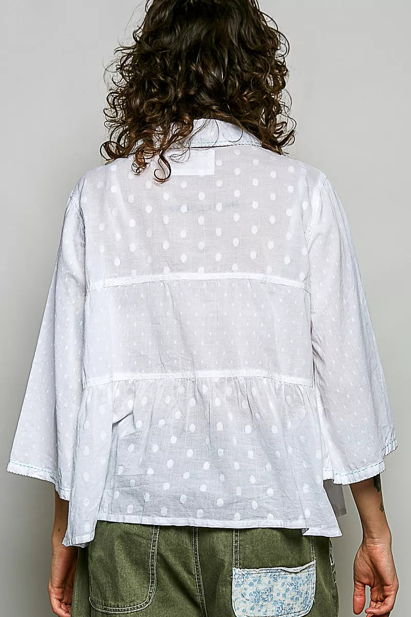 Tonal dot weave textured button-front shirt by Trendsi, featuring a casual fit and stylish pattern on soft fabric.