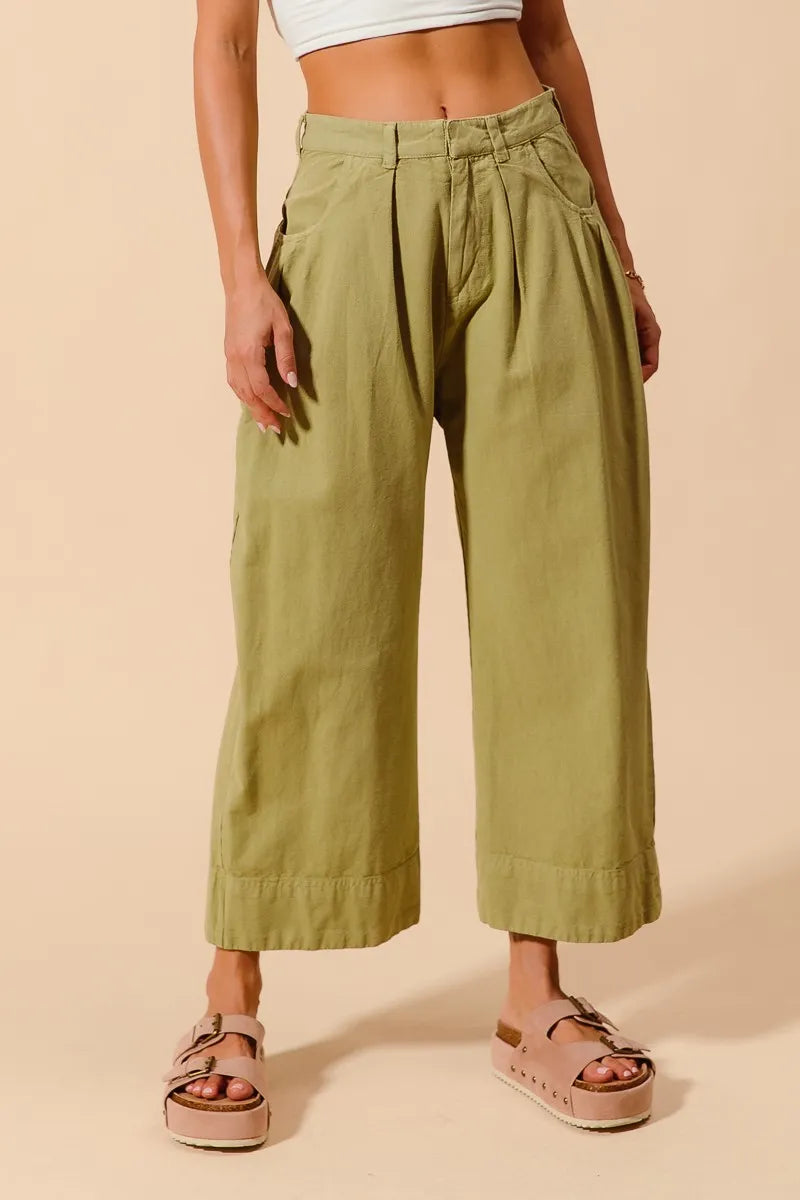 Light beige SO ME mid-rise wide-leg chino pants with pockets, styled for casual wear, from Trendsi.