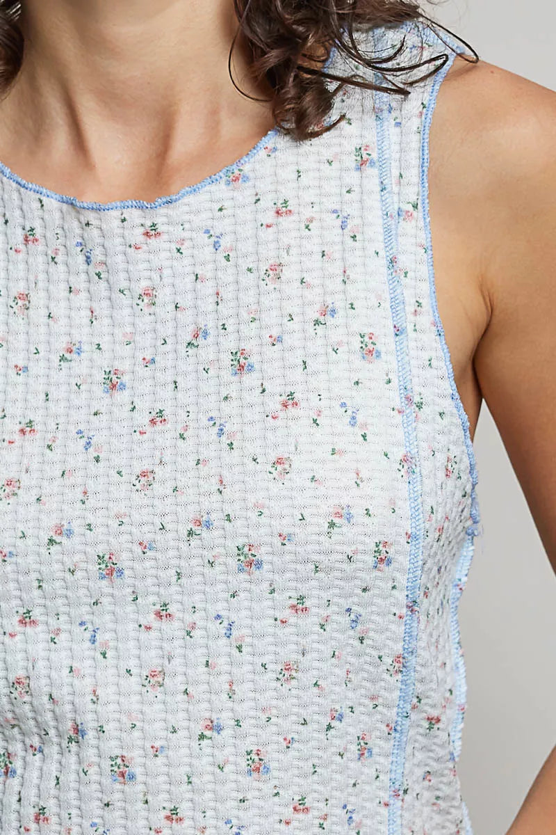 Blue floral ribbed tank top with seam details and round neckline from Trendsi, showcasing its lightweight, stretchy fabric.