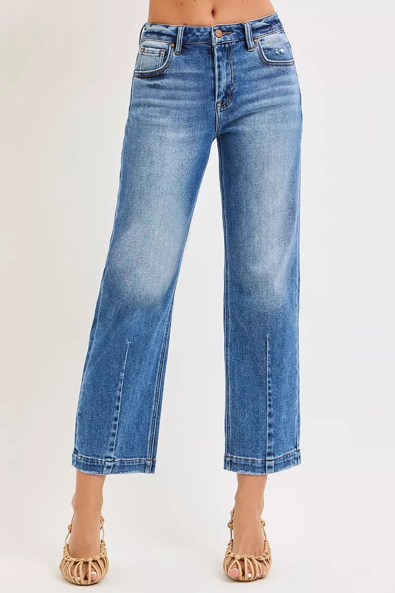Dark wash RISEN high-rise crop boyfriend tapered jeans from Trendsi, showing the relaxed fit and tapered leg silhouette.
