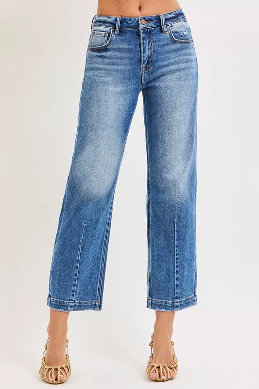 Dark wash RISEN high-rise crop boyfriend tapered jeans from Trendsi, showing the relaxed fit and tapered leg silhouette.