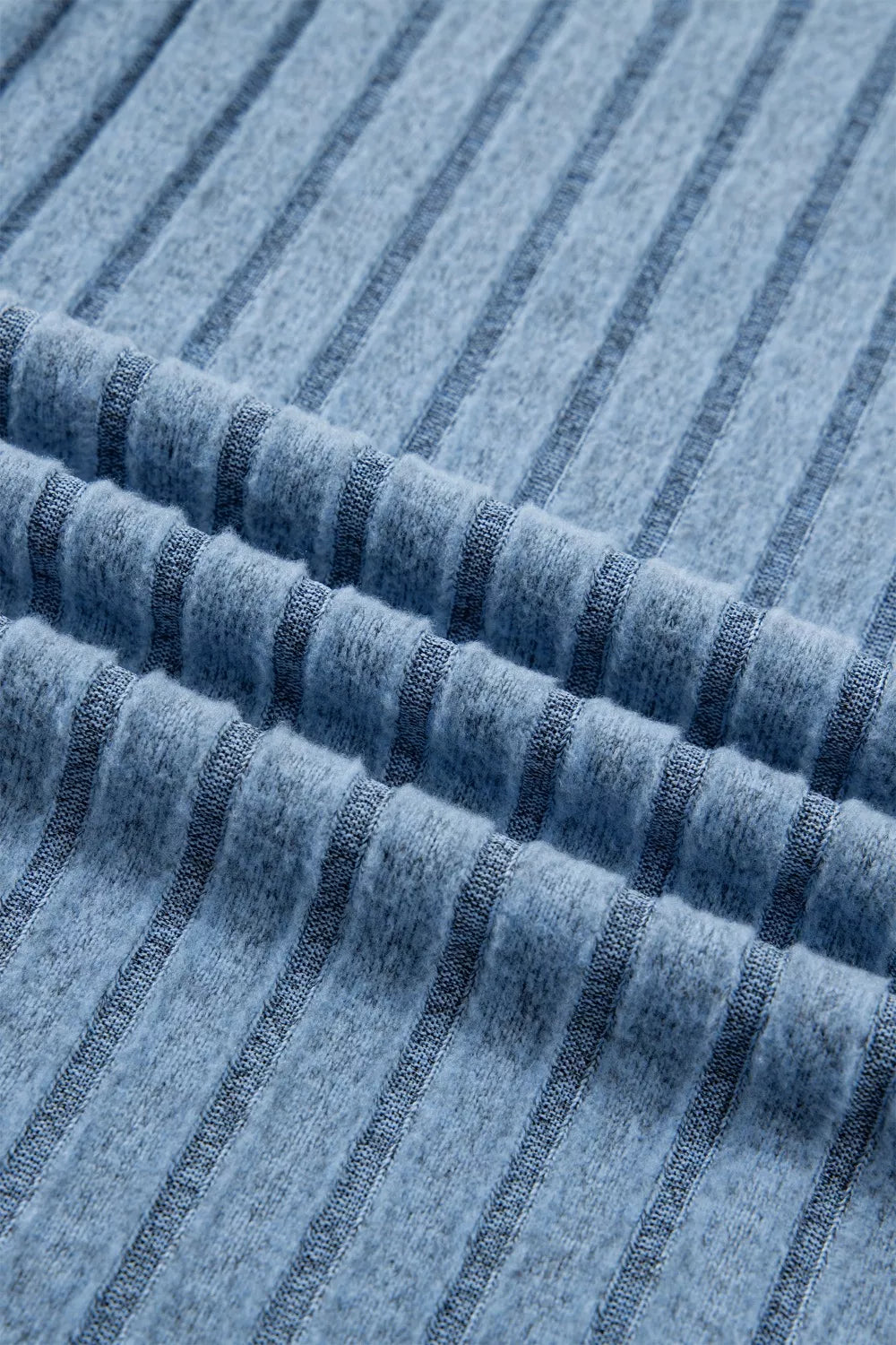 Dusty blue Trendsi slim ribbed mineral wash tank top displayed on a model, showcasing its fitted style and textured fabric.