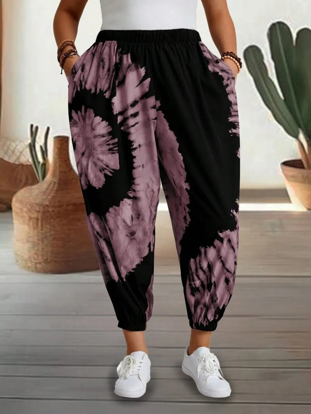 Dusty pink tie-dye elastic waist pants by Trendsi, featuring a relaxed fit and comfortable stretch fabric.