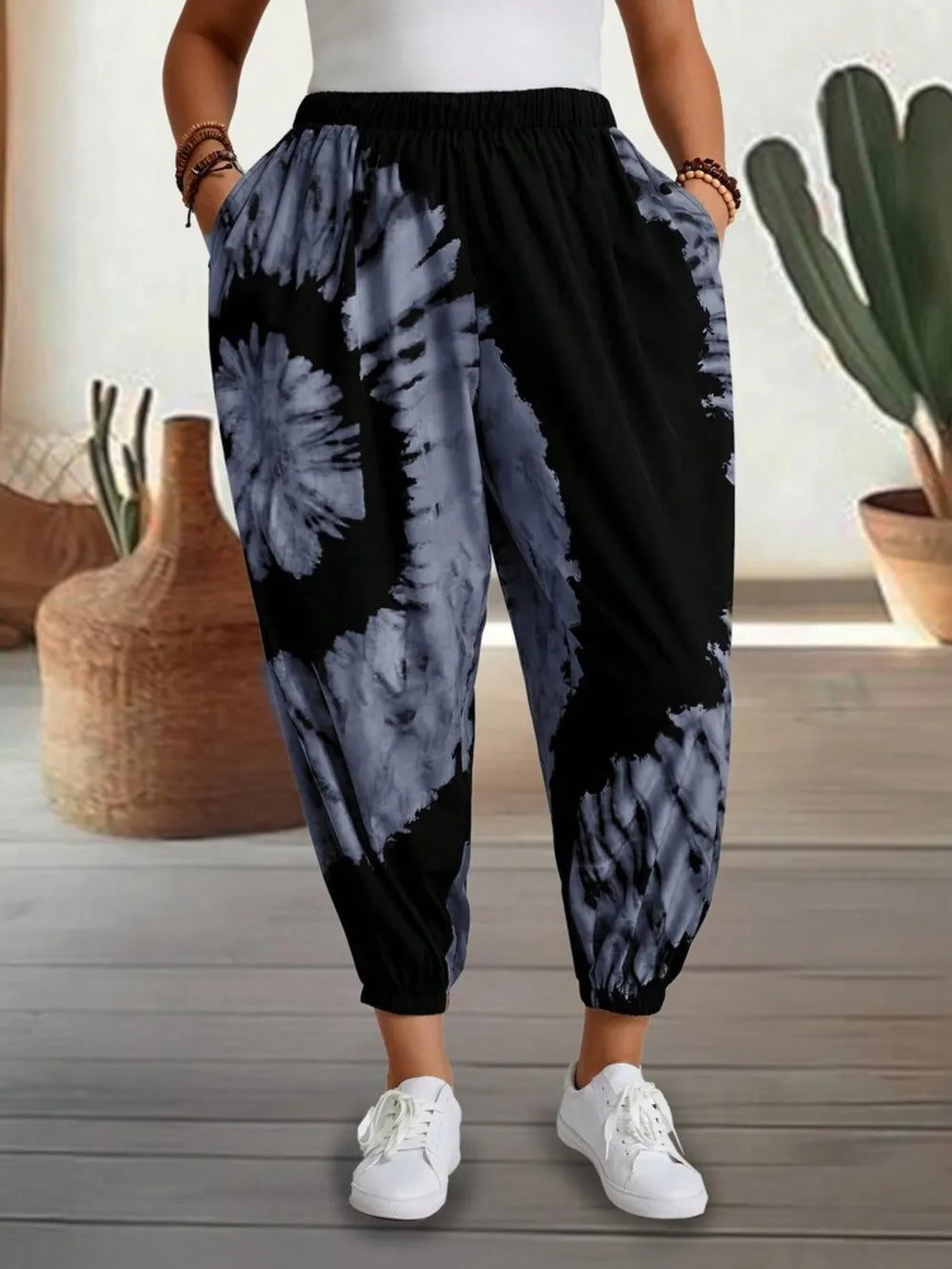 Dusty pink tie-dye elastic waist pants by Trendsi, featuring a relaxed fit and comfortable stretchy waistband.