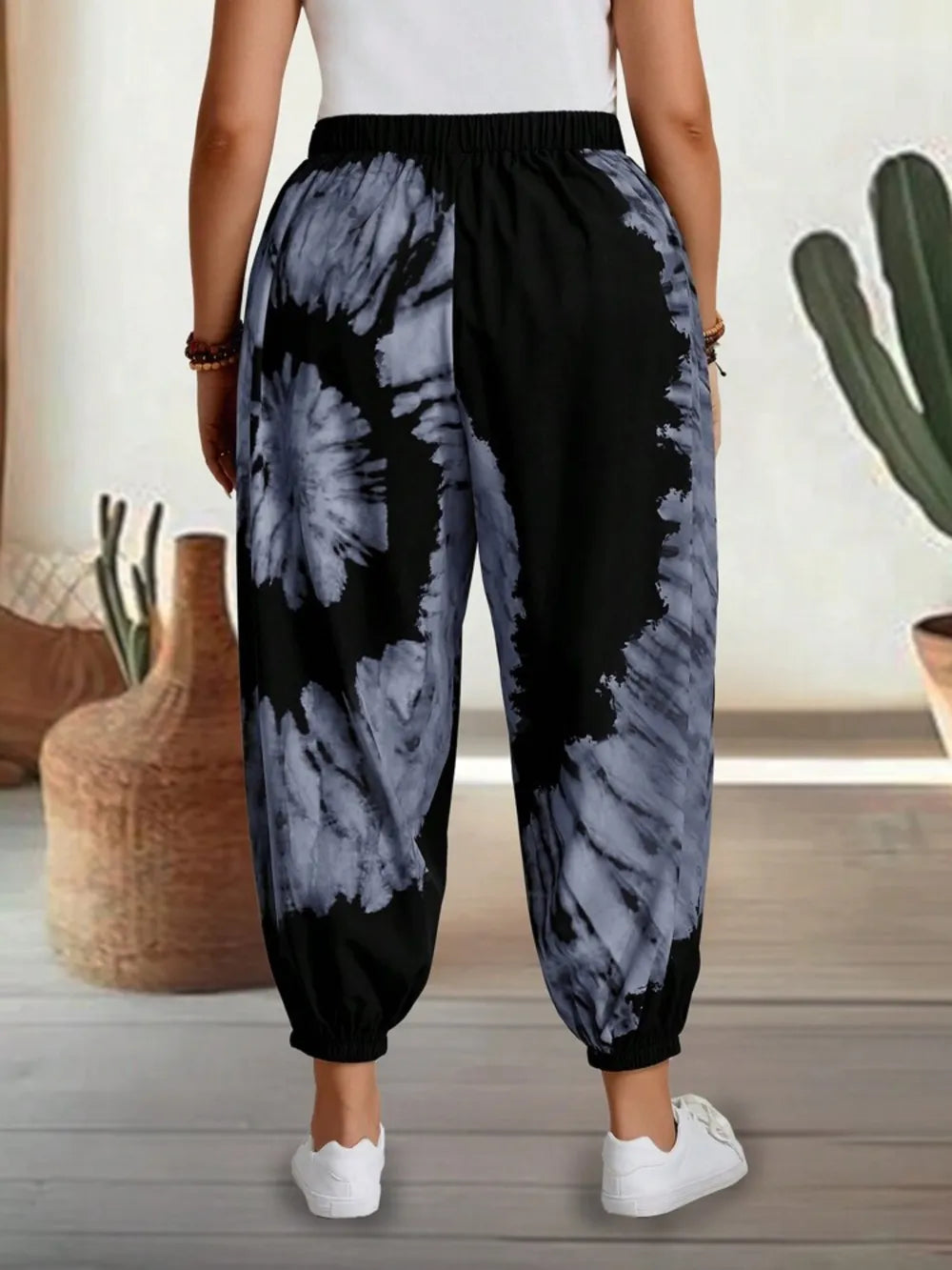 Dusty pink tie-dye elastic waist pants by Trendsi, featuring a relaxed fit and vibrant tie-dye pattern.